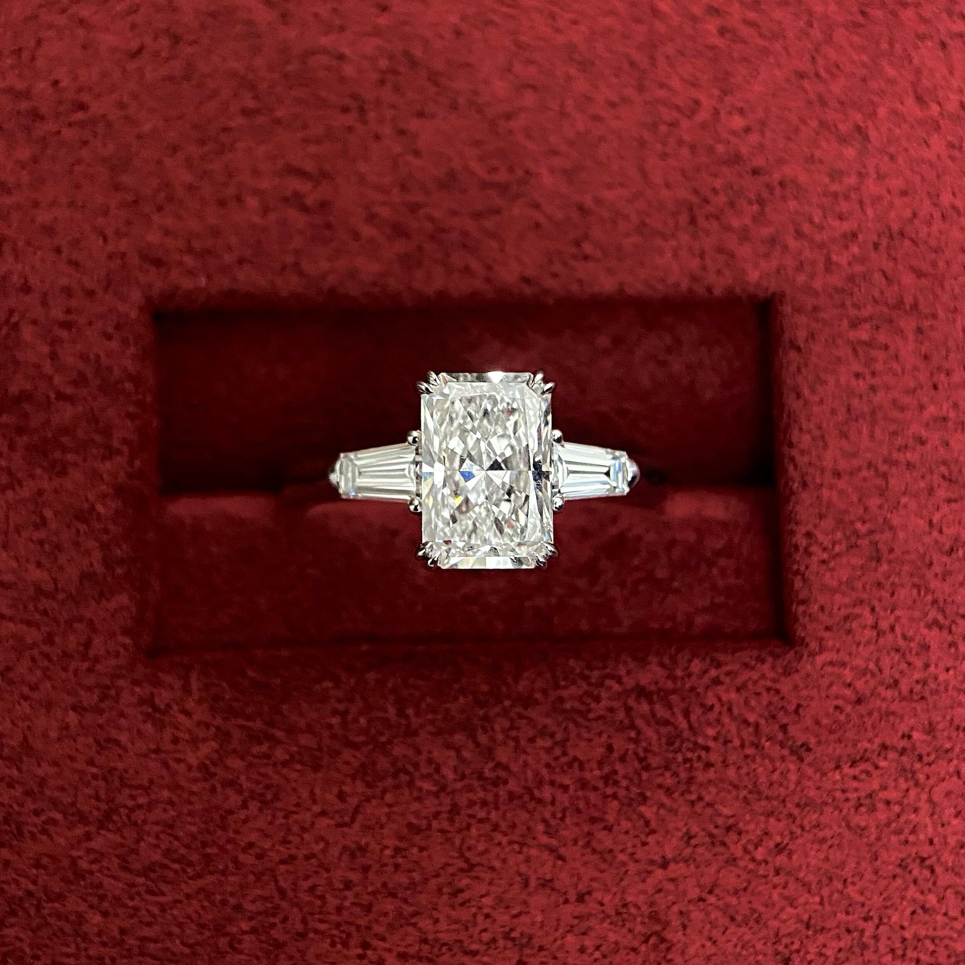 Radiant cut CVD diamond three stone engagement ring