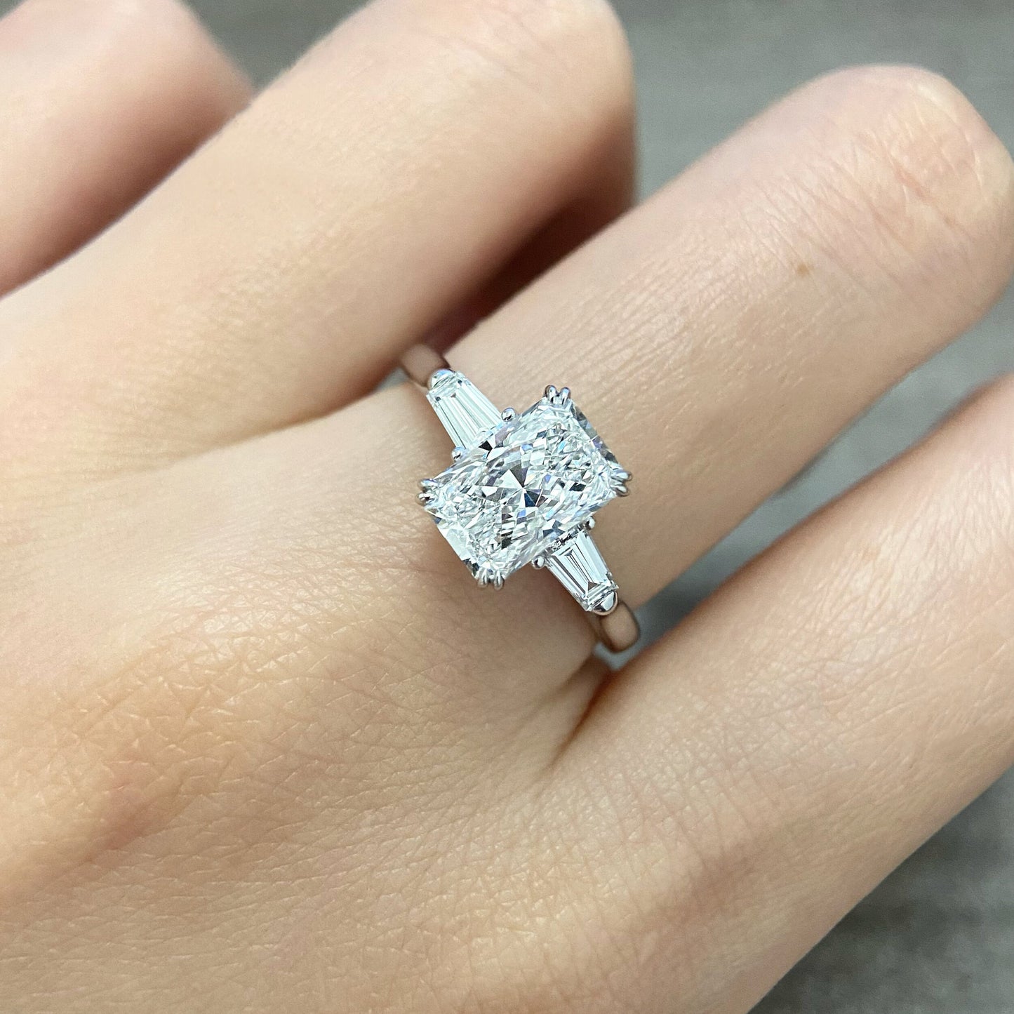 Radiant cut CVD diamond three stone engagement ring