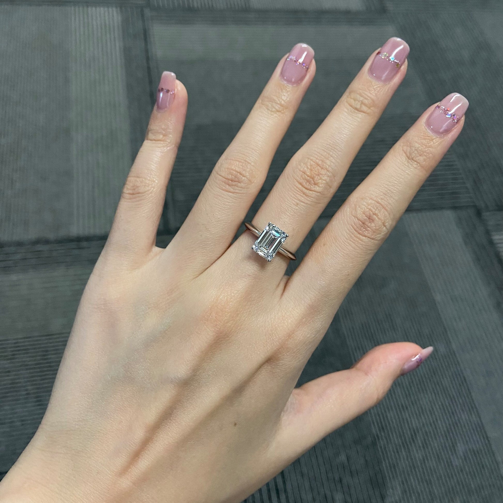 Emerald cut CVD diamond solitaire engagement ring