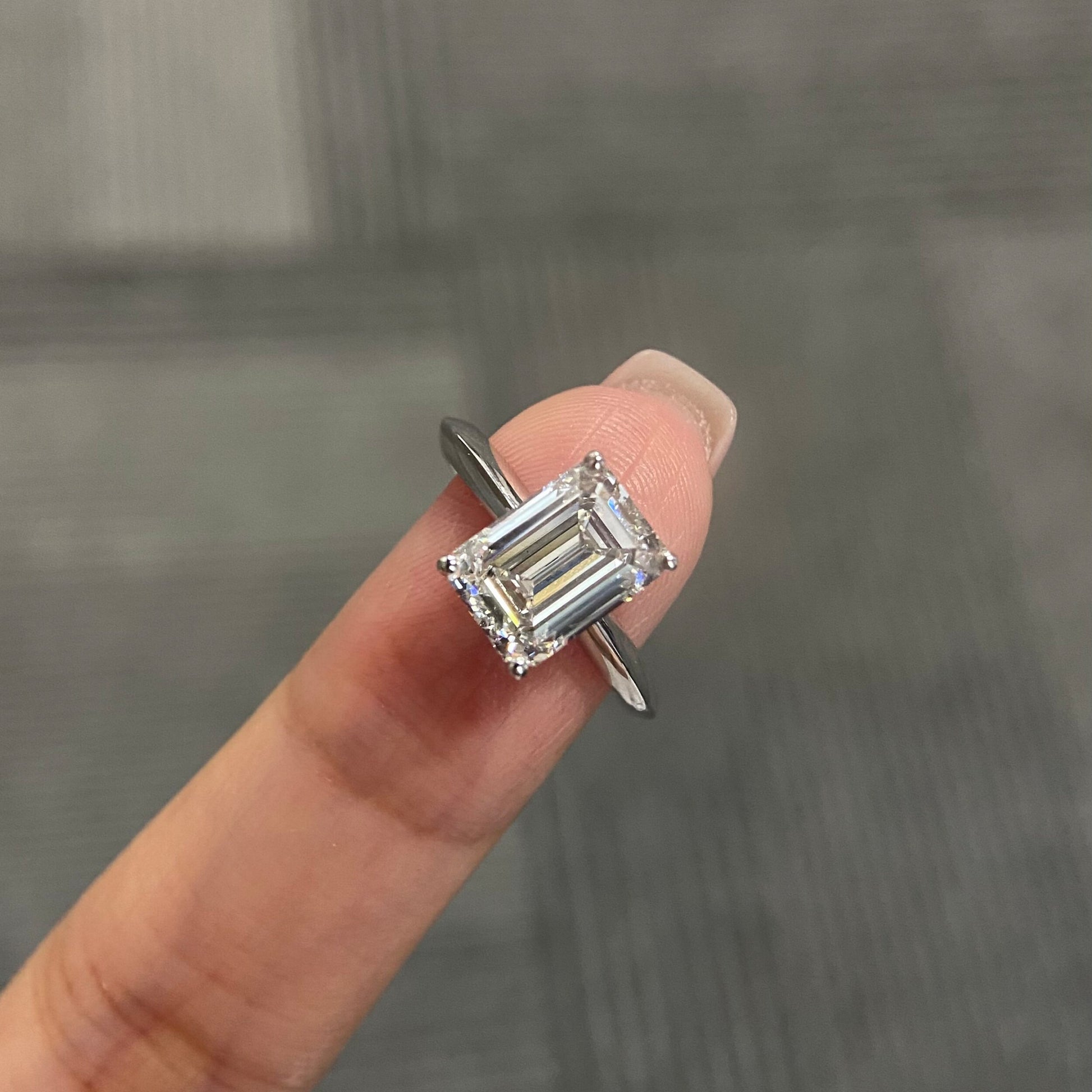 Emerald cut CVD diamond solitaire engagement ring