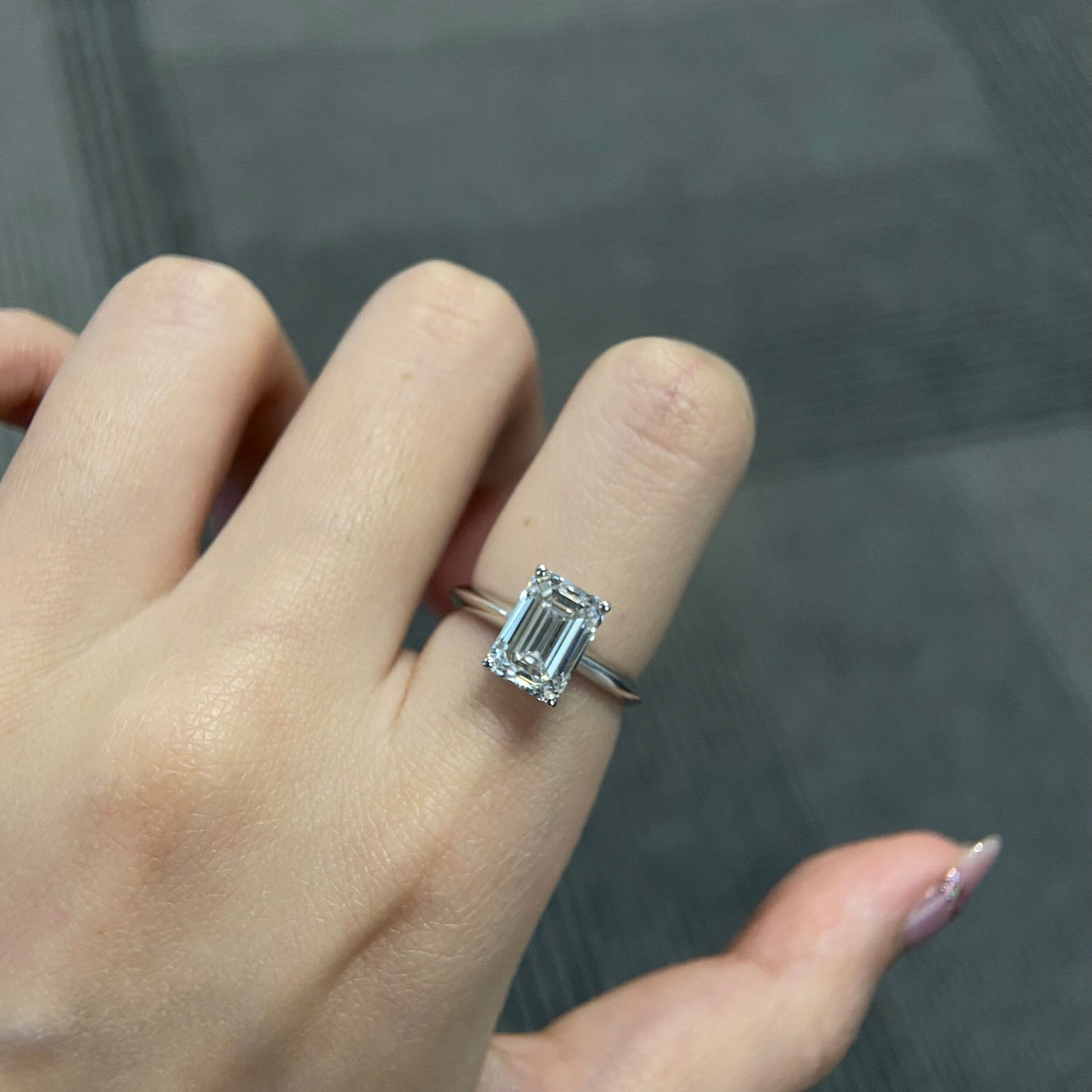 Emerald cut CVD diamond solitaire engagement ring