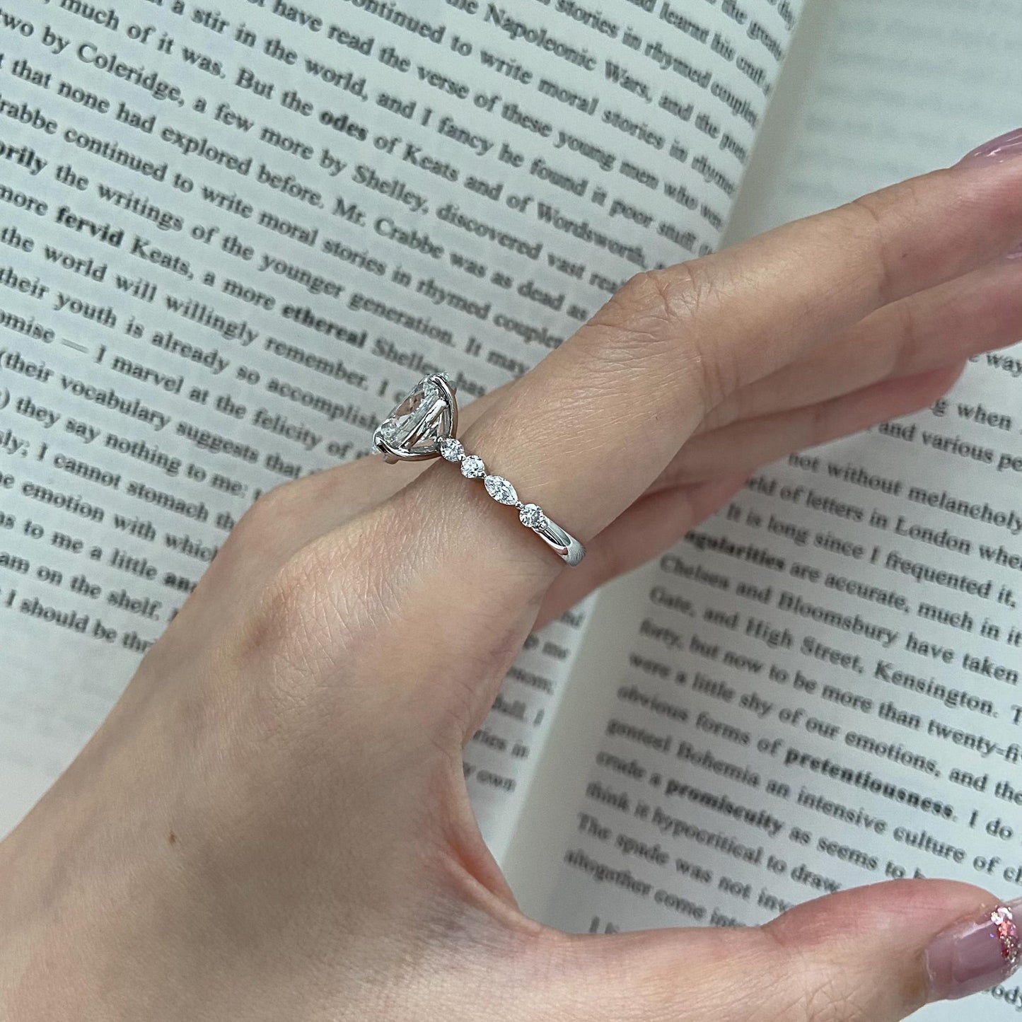 Oval CVD diamond engagement ring in dainty setting
