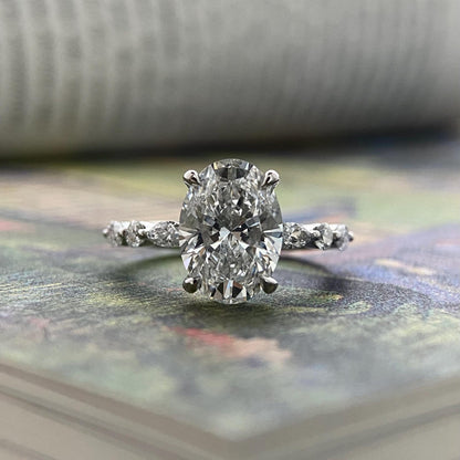 Oval CVD diamond engagement ring in dainty setting