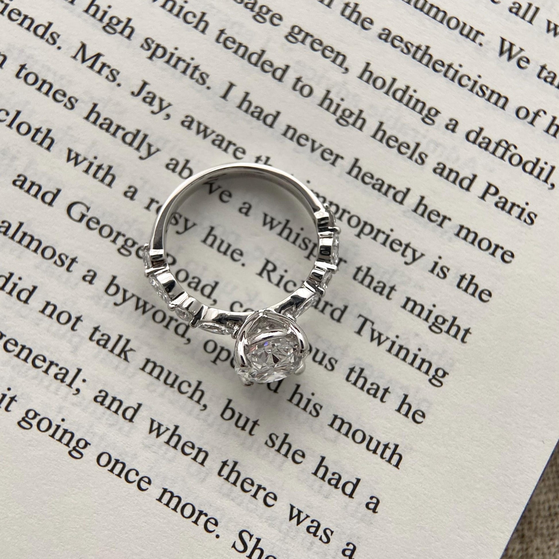 Oval CVD diamond engagement ring in dainty setting