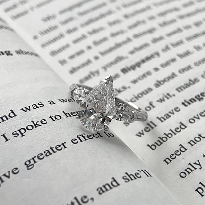 Pear cut CVD diamond three stone style engagement ring