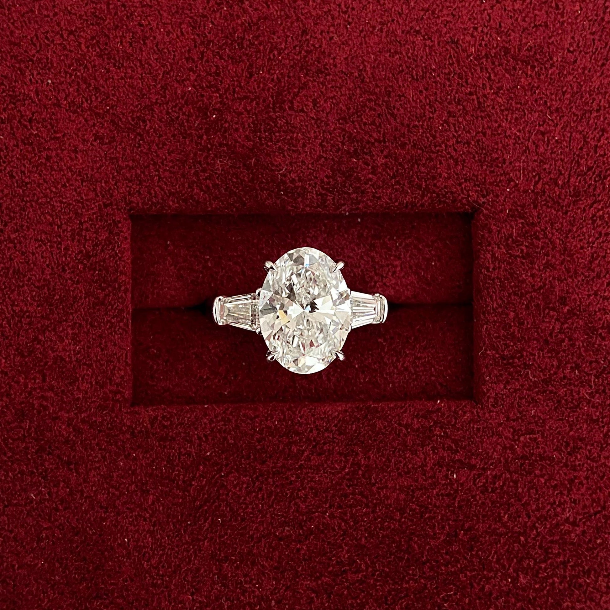 Oval cut CVD diamond three stone engagement ring