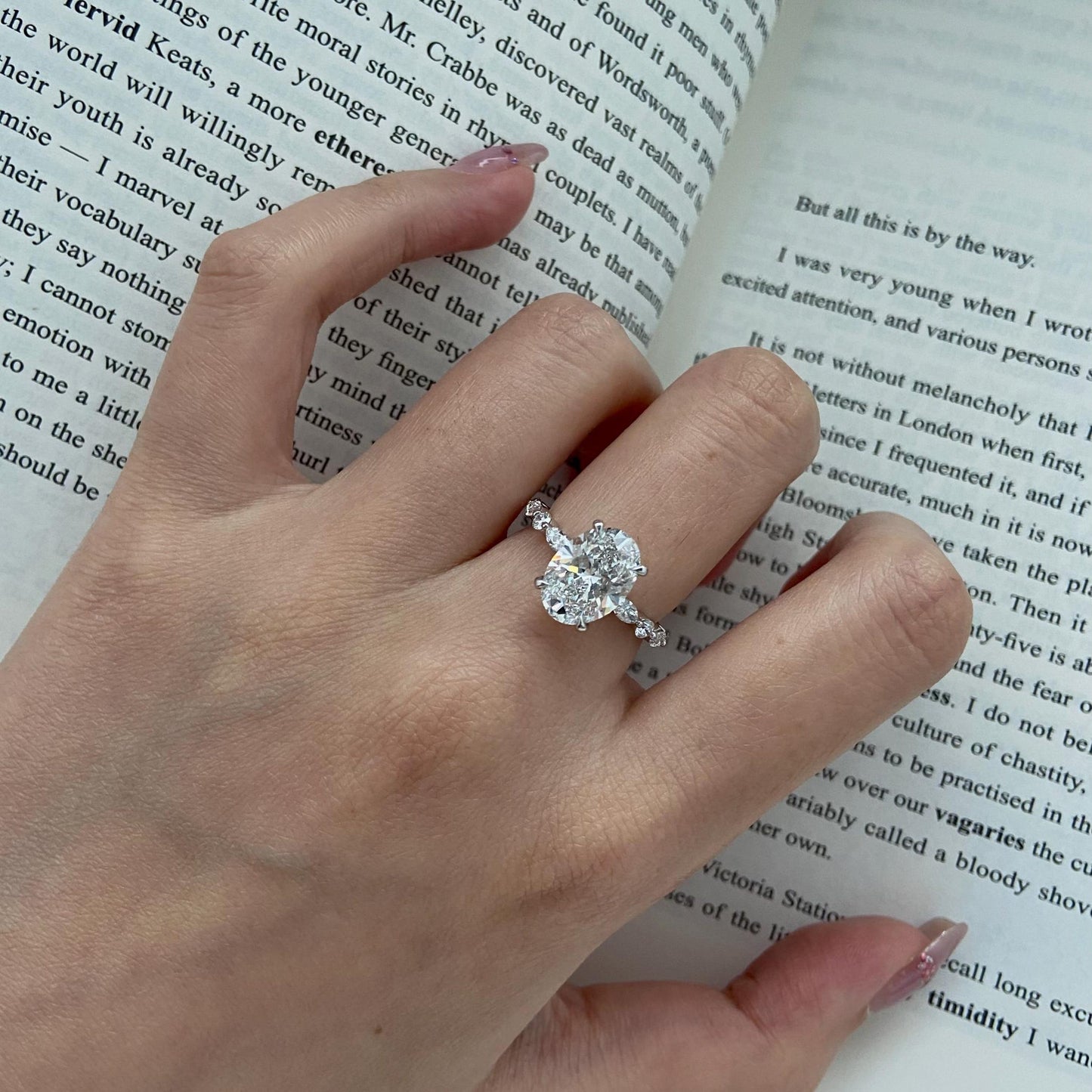 Oval CVD diamond engagement ring in dainty setting