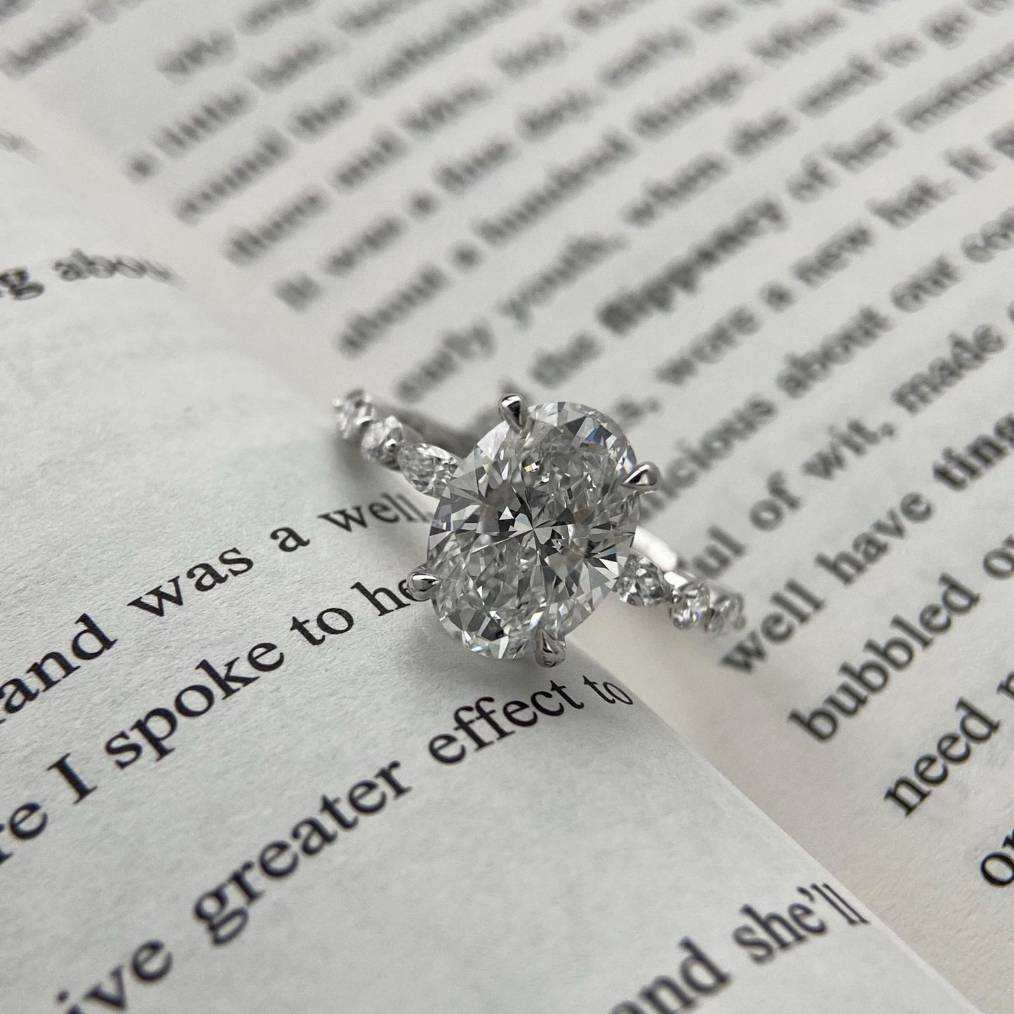 Oval CVD diamond engagement ring in dainty setting