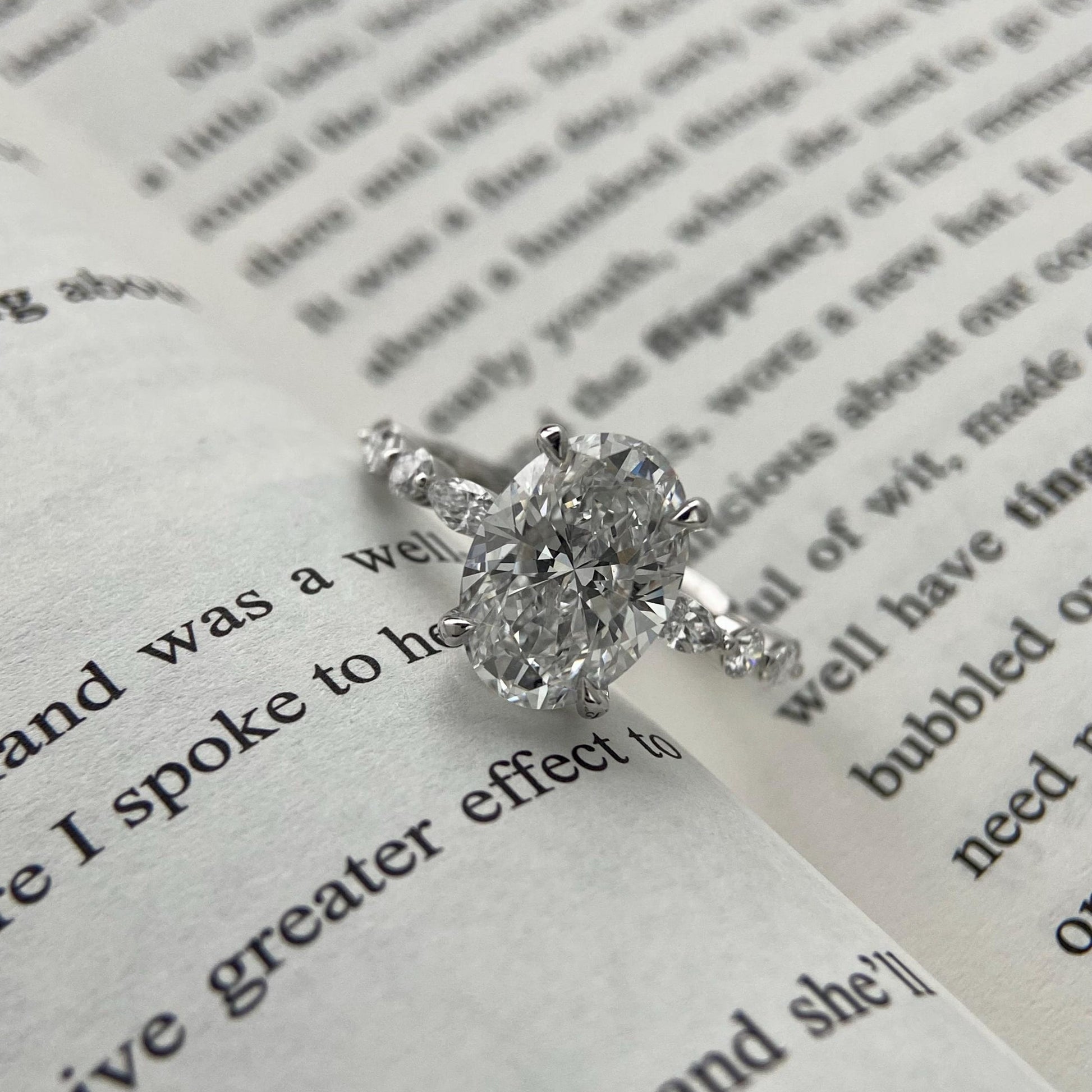 Oval CVD diamond engagement ring in dainty setting