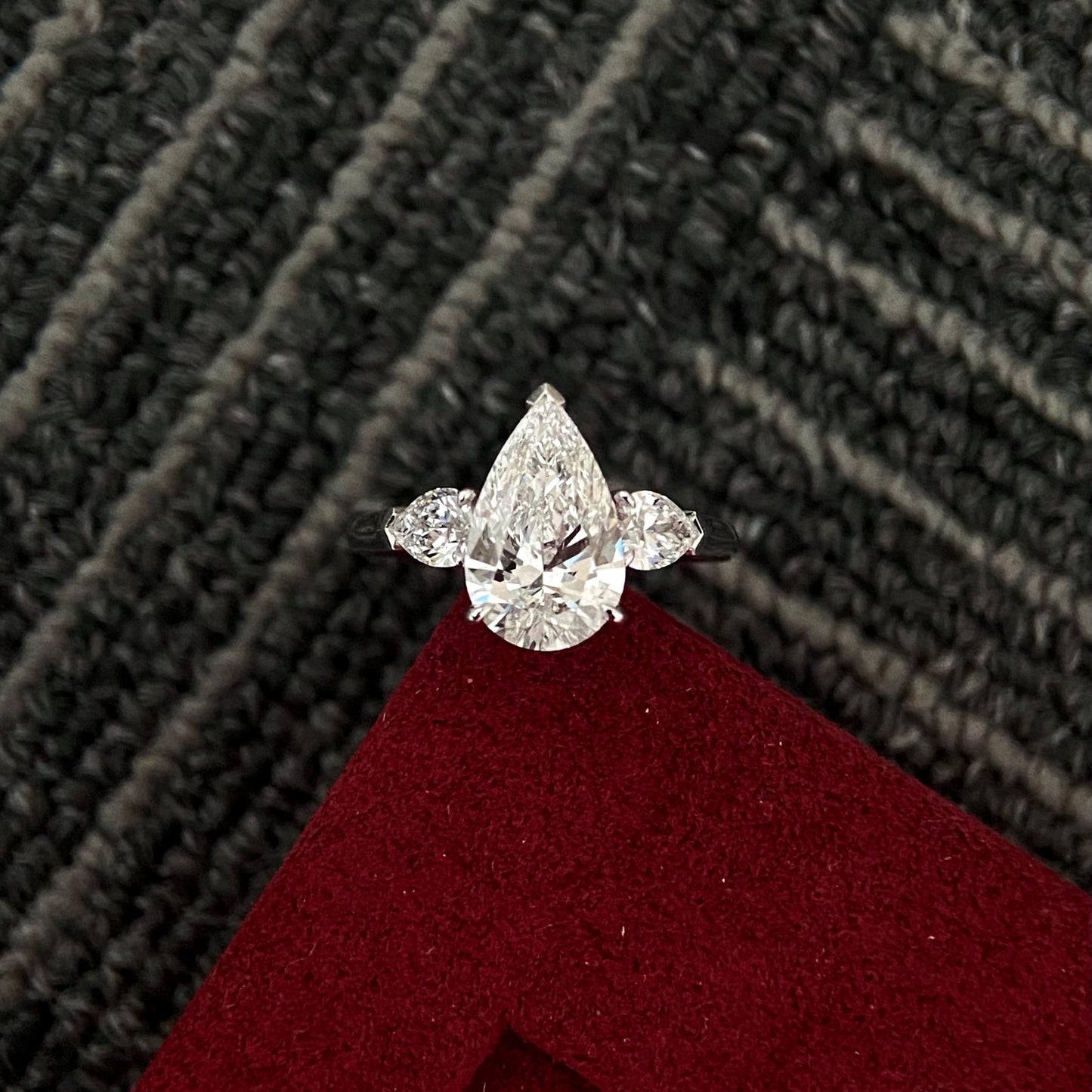 Pear cut CVD diamond three stone style engagement ring