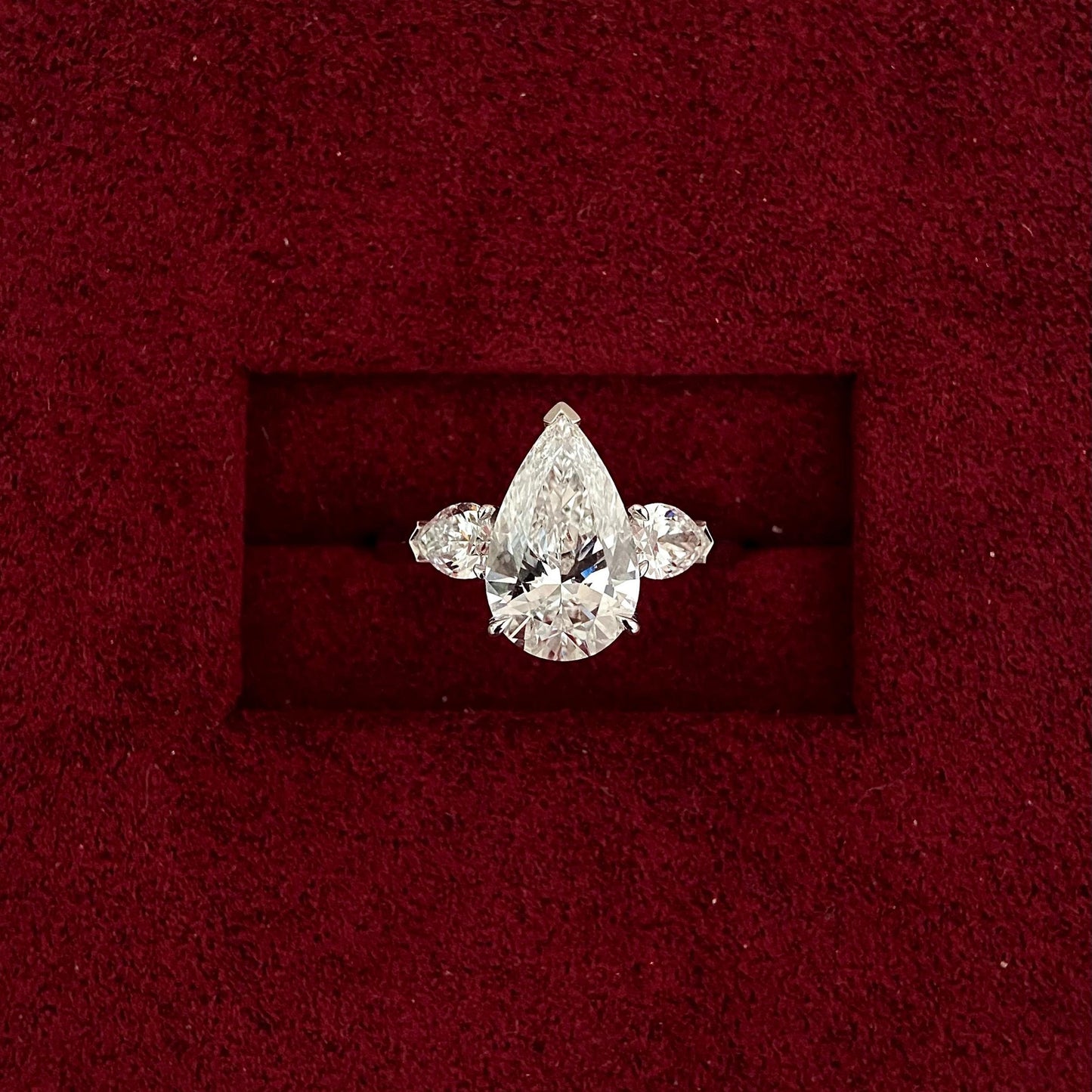 Pear cut CVD diamond three stone style engagement ring