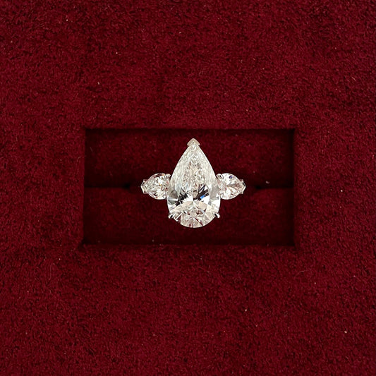 Pear cut CVD diamond three stone style engagement ring