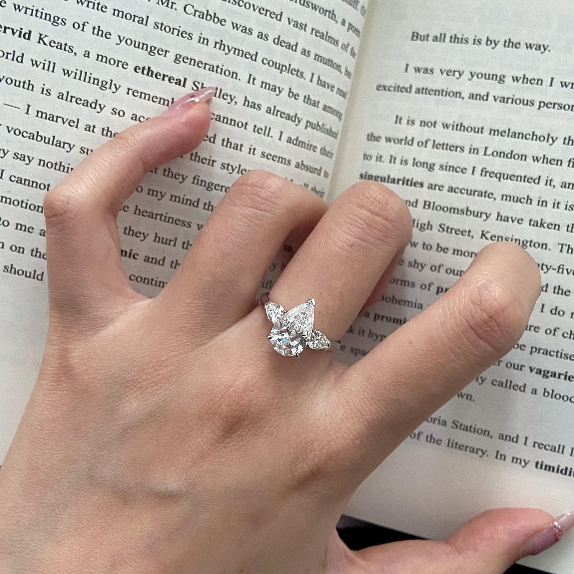 Pear cut CVD diamond three stone style engagement ring