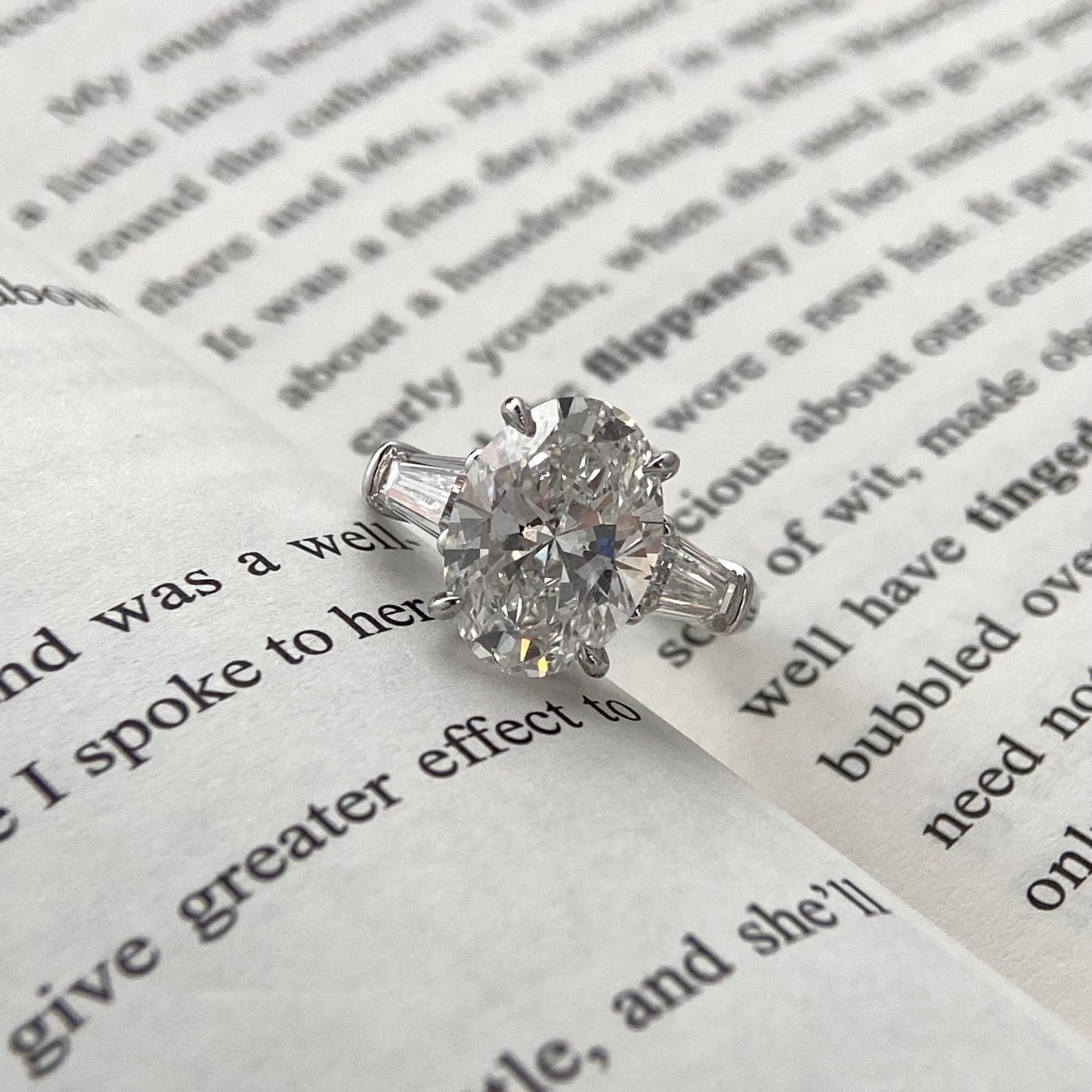 Oval cut CVD diamond three stone engagement ring