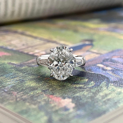 Oval cut CVD diamond three stone engagement ring