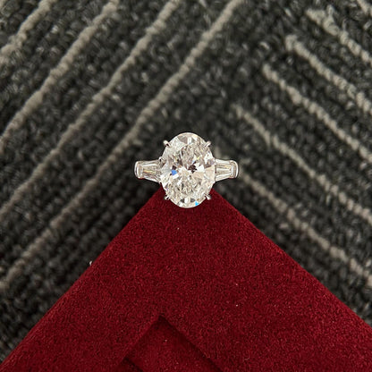 Oval cut CVD diamond three stone engagement ring