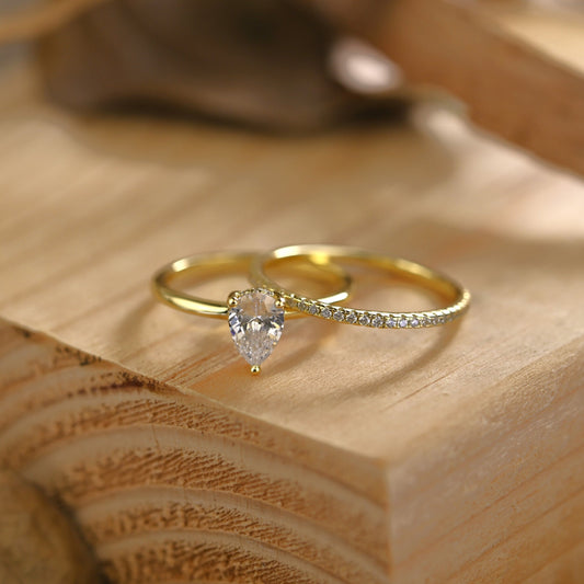 Hidden Halo Bridal Ring Set with 0.75 CT Pear Cut Moissanite