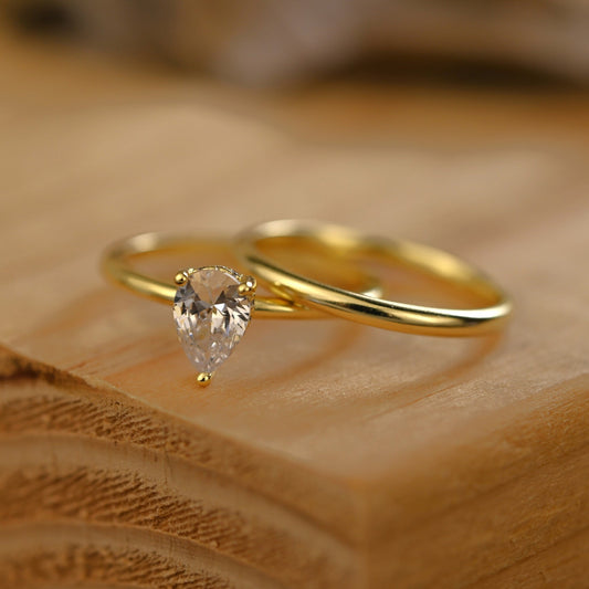 Hidden Halo Bridal Ring Set with 0.75 CT Pear Cut Moissanite