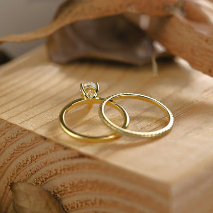 Hidden Halo Bridal Ring Set with 0.75 CT Pear Cut Moissanite