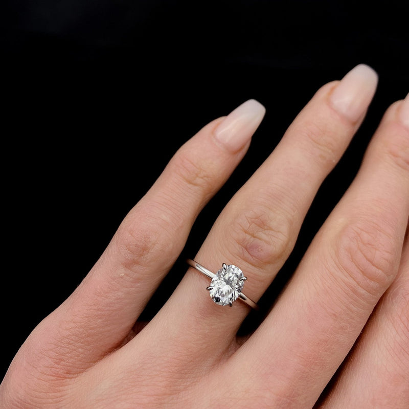 Elegant solitaire engagement ring with oval cut moissanite stone
