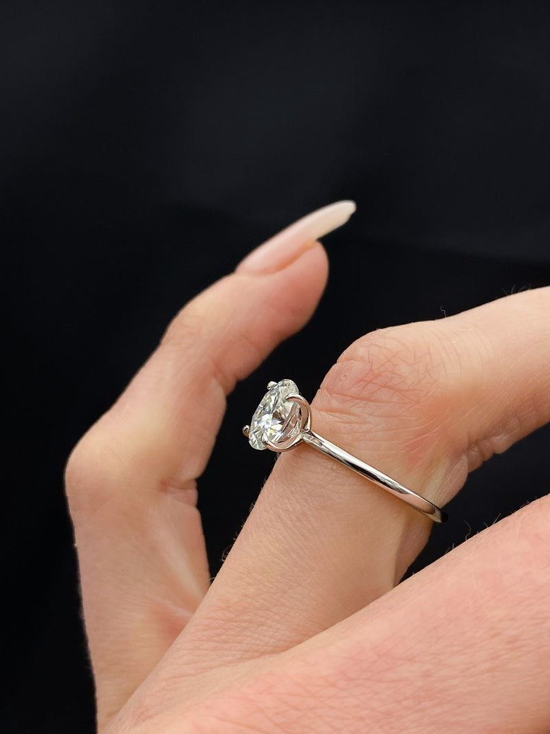 Elegant solitaire engagement ring with oval cut moissanite stone