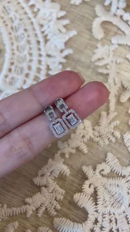 Halo Stud Earrings with 0.60 TCW Emerald Cut Moissanite