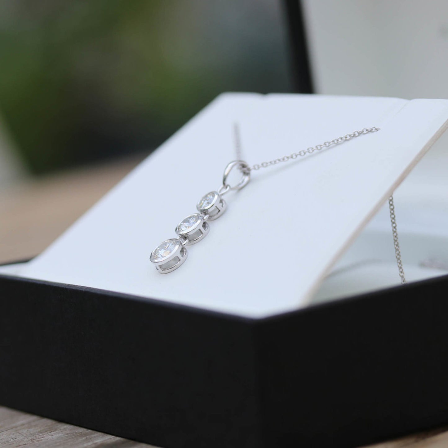 Triple Bezel Necklace with 0.60 TCW Round Cut Moissanite
