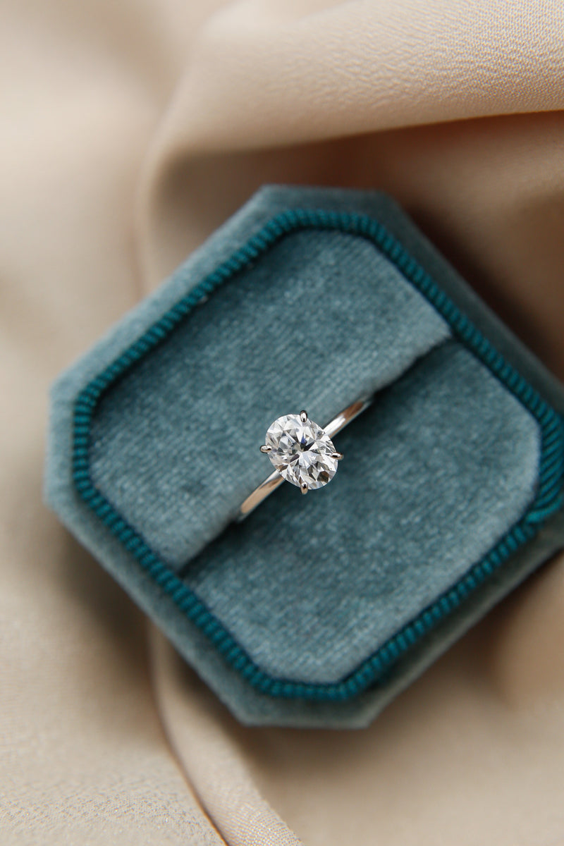 Elegant solitaire engagement ring with oval cut moissanite stone