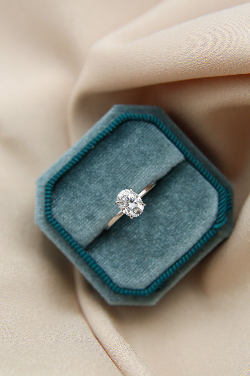 Elegant solitaire engagement ring with oval cut moissanite stone