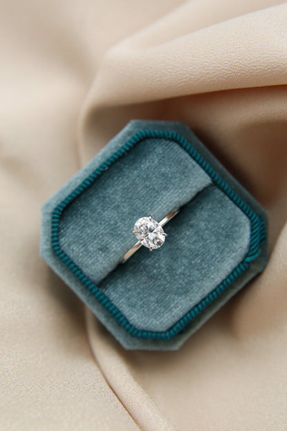 Elegant solitaire engagement ring with oval cut moissanite stone