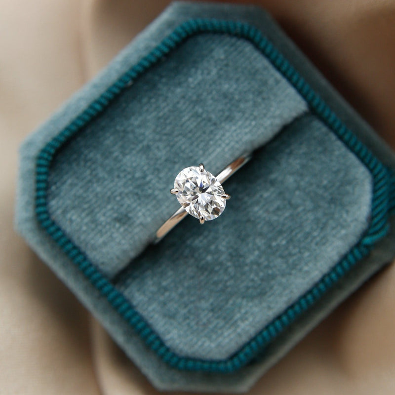 Elegant solitaire engagement ring with oval cut moissanite stone